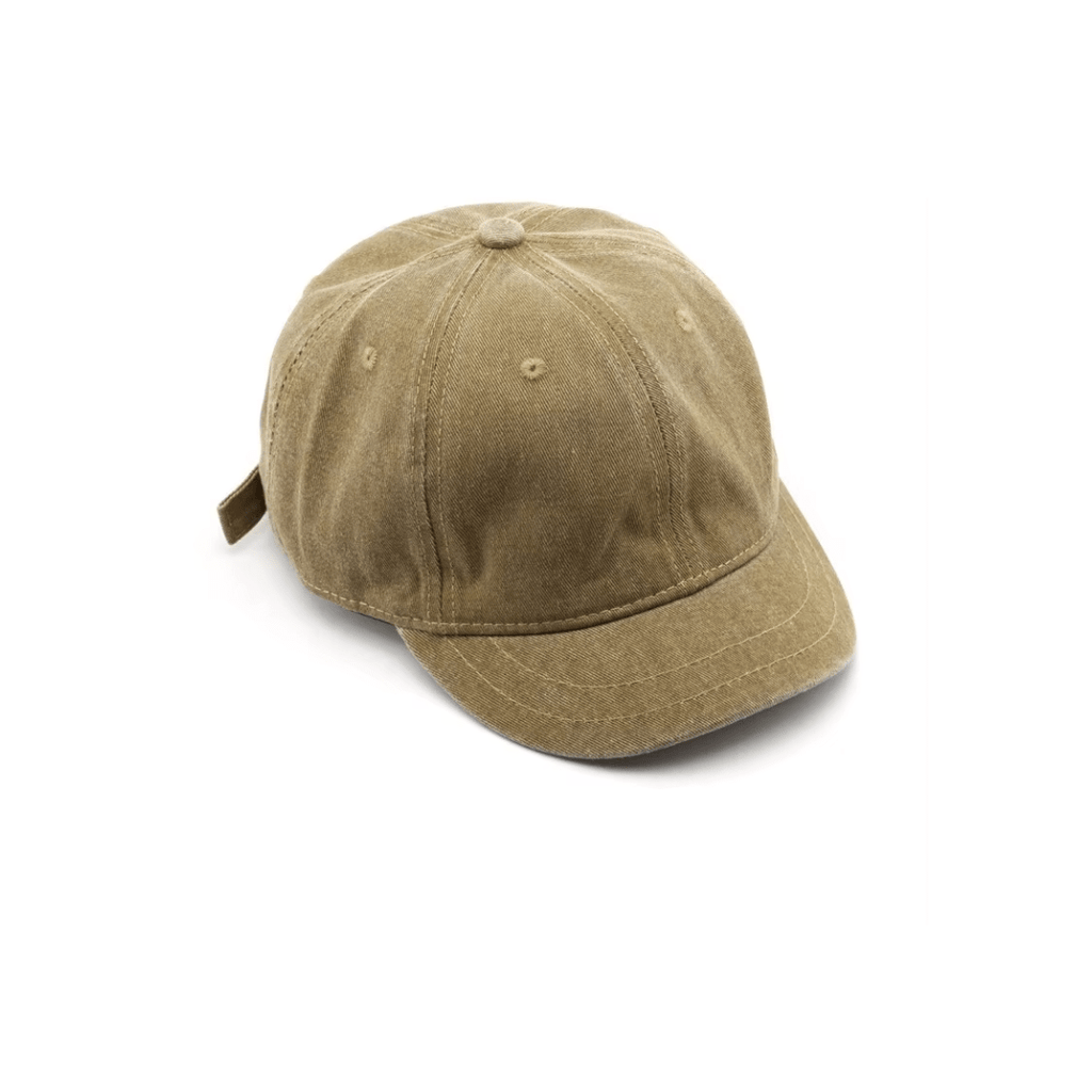 Right side profile of washed khaki logo-free cap, adjustable brass strap